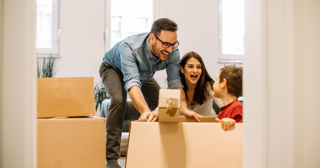 A happy family plays in their apartment 